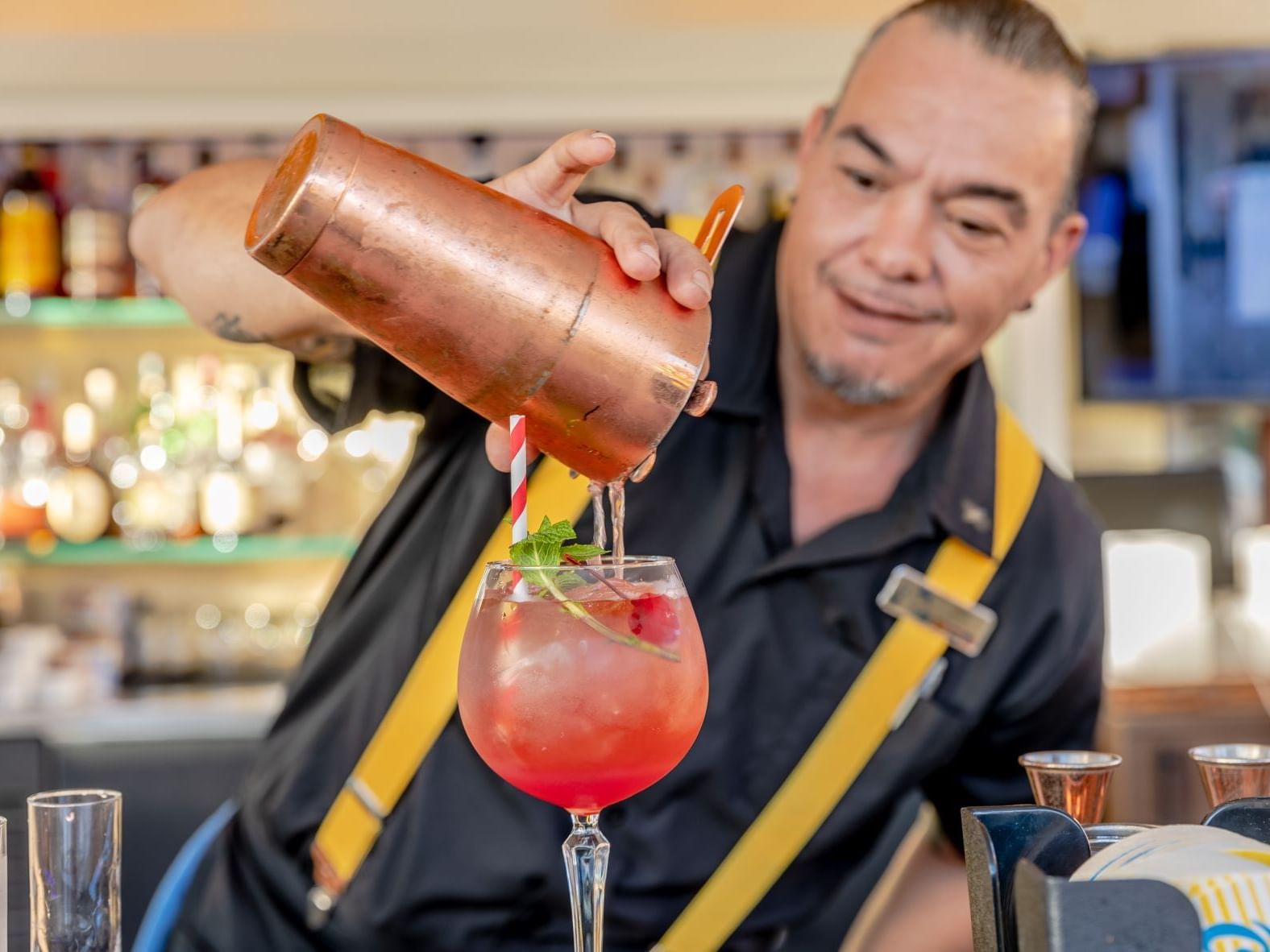 Bartender making drinks at Horizons Lounge