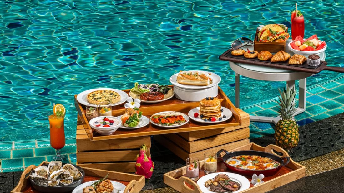 Buffet spread by the pool at Sunway Hotel Pyramid, featuring Splash & Brunch buffet offer