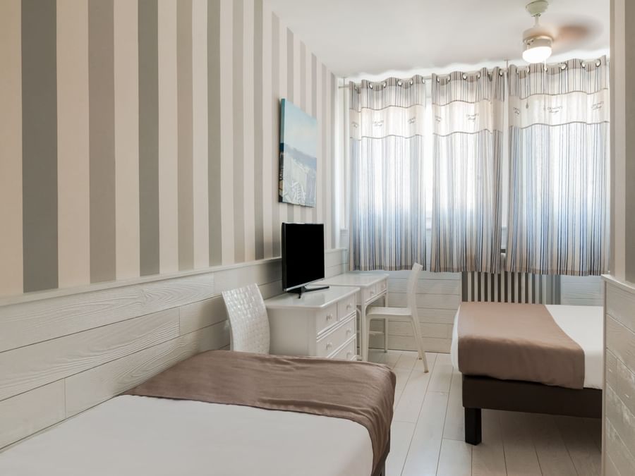 Bed & furniture in Hotel Miramar at The Originals Hotel