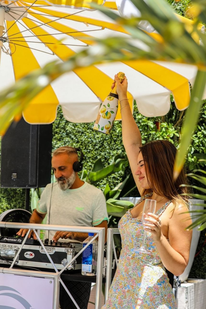 A lady enjoying herself at a DJ party in Clinton Hotel South