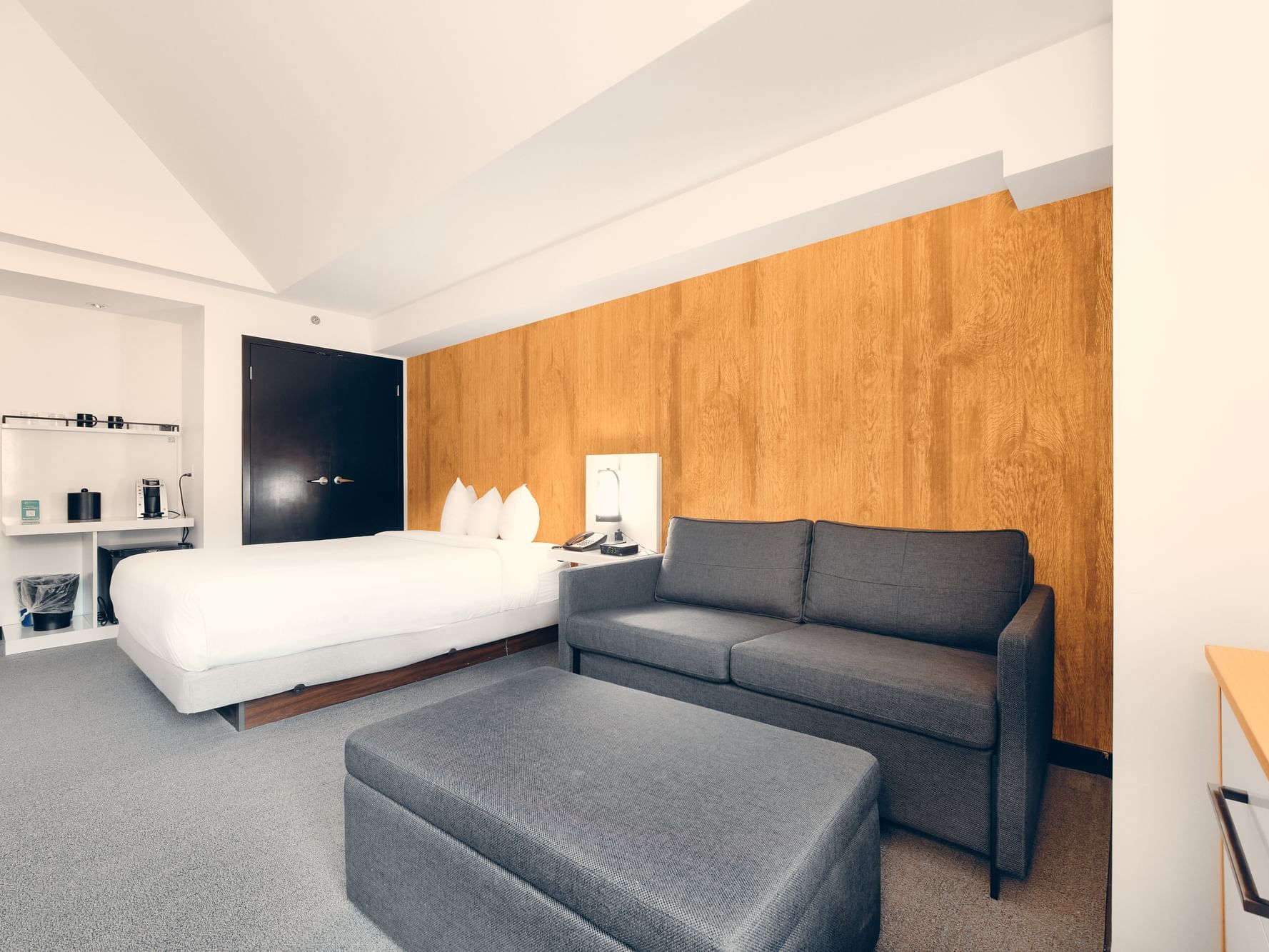 Deluxe Queen Hotel room interior with a sofa bed at the Paradox Aava Whistler Hotel.