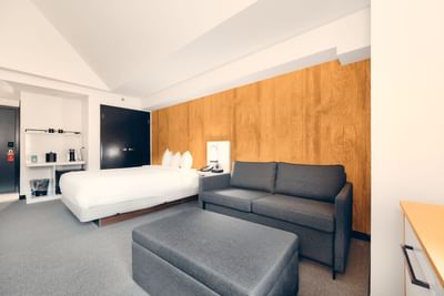 Bed & couch in Deluxe Queen + Sofa Bed at Aava Whistler Hotel