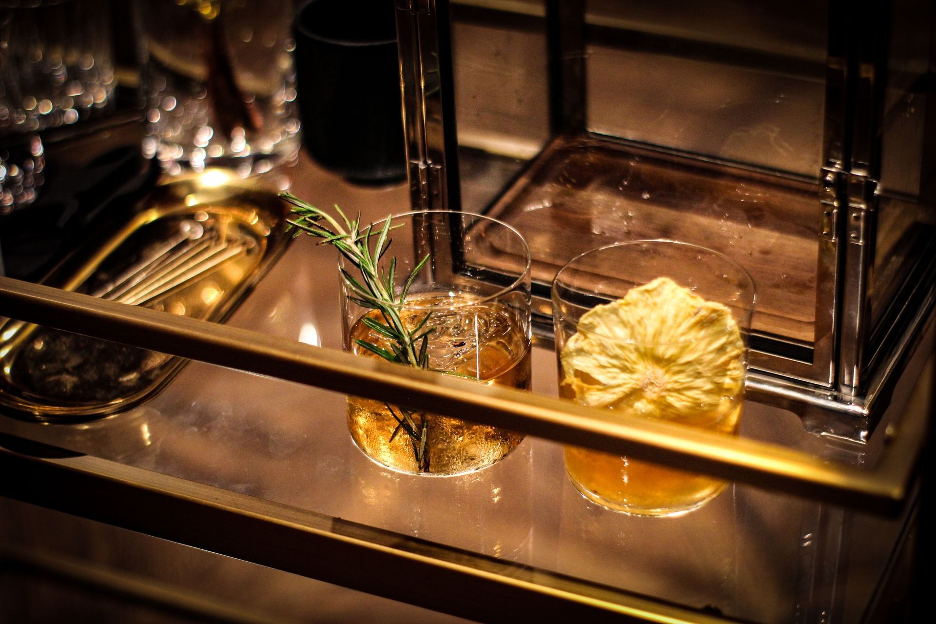 two cocktails on a bar