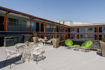 Arranged seating on the rooftop with a scenic view at Becks Motor Lodge