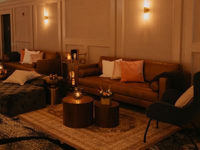 Sofas arranged in a cozy event room at Carriage House Hotel