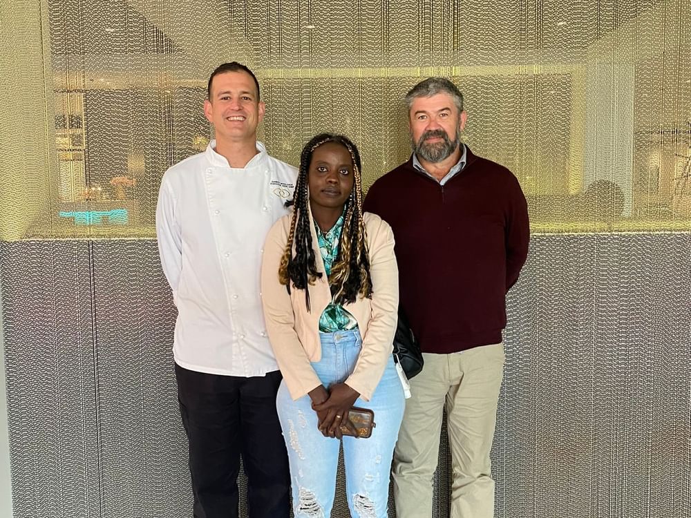 Three people of hotel staff posing for a picture at Sofitel Brisbane Central