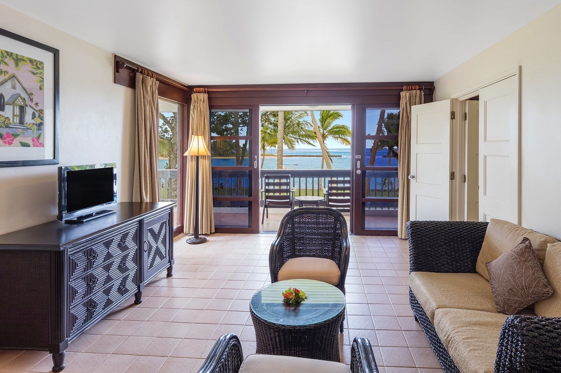 Lounge area with a balcony in Studio Villa at Naviti Resort