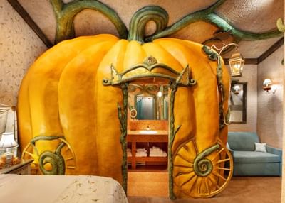 Large pumpkin structure as a bathroom entrance, with adorning furnishings in Cinderella's Gown at The Roxbury