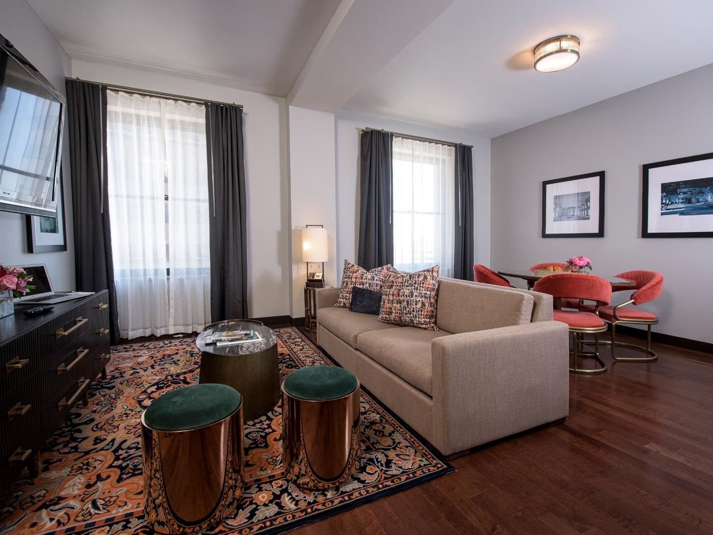 TV lounge area & dining area in Studio Suite at The Mayo Hotel