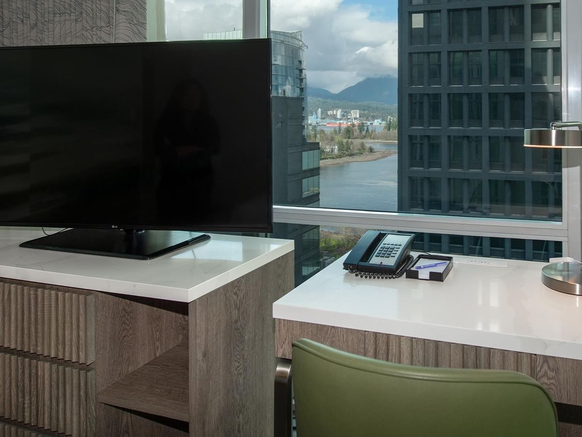 Desk with TV and phone in Coast Two Queens Corner Room.
