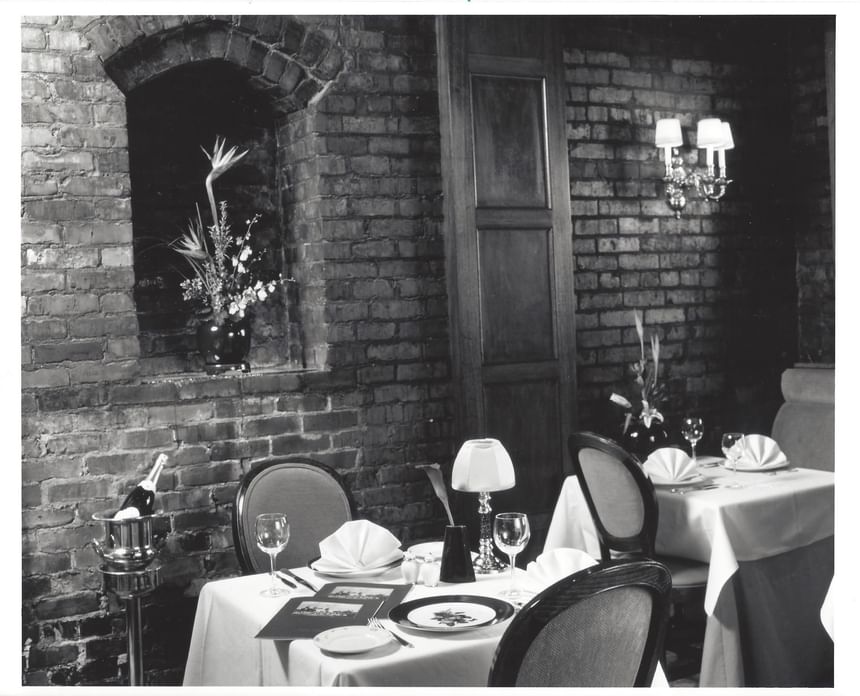 Vintage image of dining set-up with floral arrangement at Hotel Sorrento