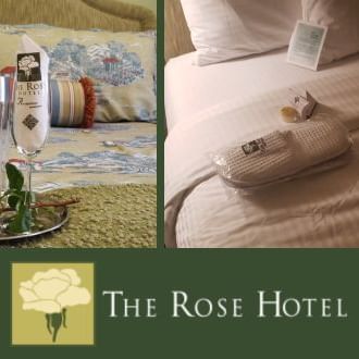 Post of The Rose Hotel featuring champagne, a cozy bed, and elegant decor
