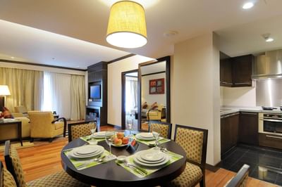Living area with dining table in One Bedroom Premier Suite at MiCasa All Suite Hotel KL
