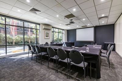 U-shaped meeting table in Banks Room at Amora Hotel Melbourne