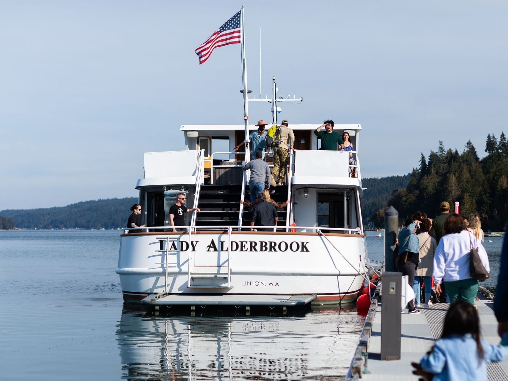 Lady Alderbrook Charter parked by the crowded deck near Alderbrook Resort & Spa