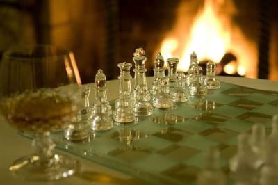 Chess board in front of fireplace