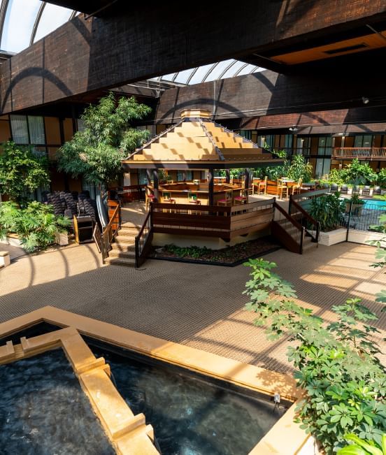 Indoor Courtyard Pool area with a Retractable Roof and Cocktail Service at M Hotel Buffalo