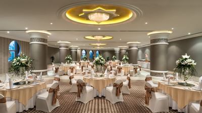 Banquet tables arranged in a Hall for an event at Ajman Hotel