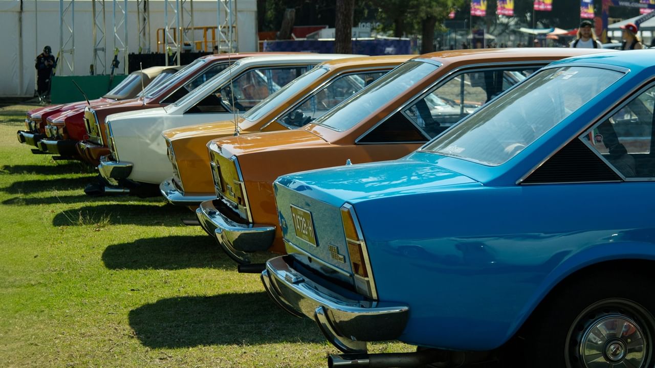 Vintage cars lined up in a row.