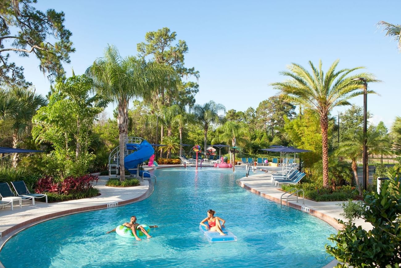 Distant view of People enjoying on tubes in pool of Surfari Water Park at The Grove Resort & Water Park