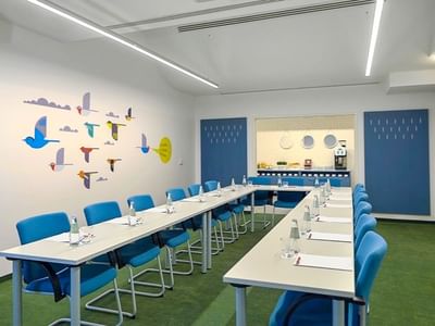 U shaped table setup in a meeting room at Metropol Hotel