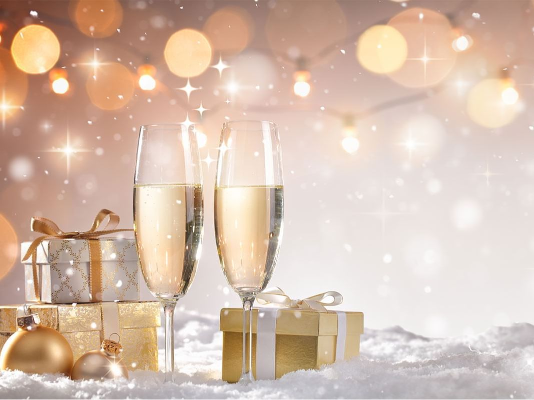 Flutes with Champagne and Christmas Gifts