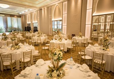 Banquet tables arranged in a Hall for an event at Ajman Hotel