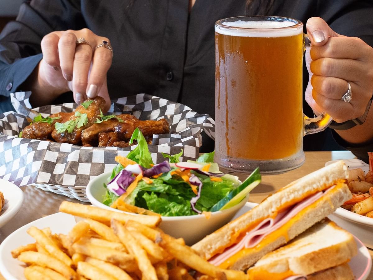 Wings, fries, salad, sandwiches, and beer
