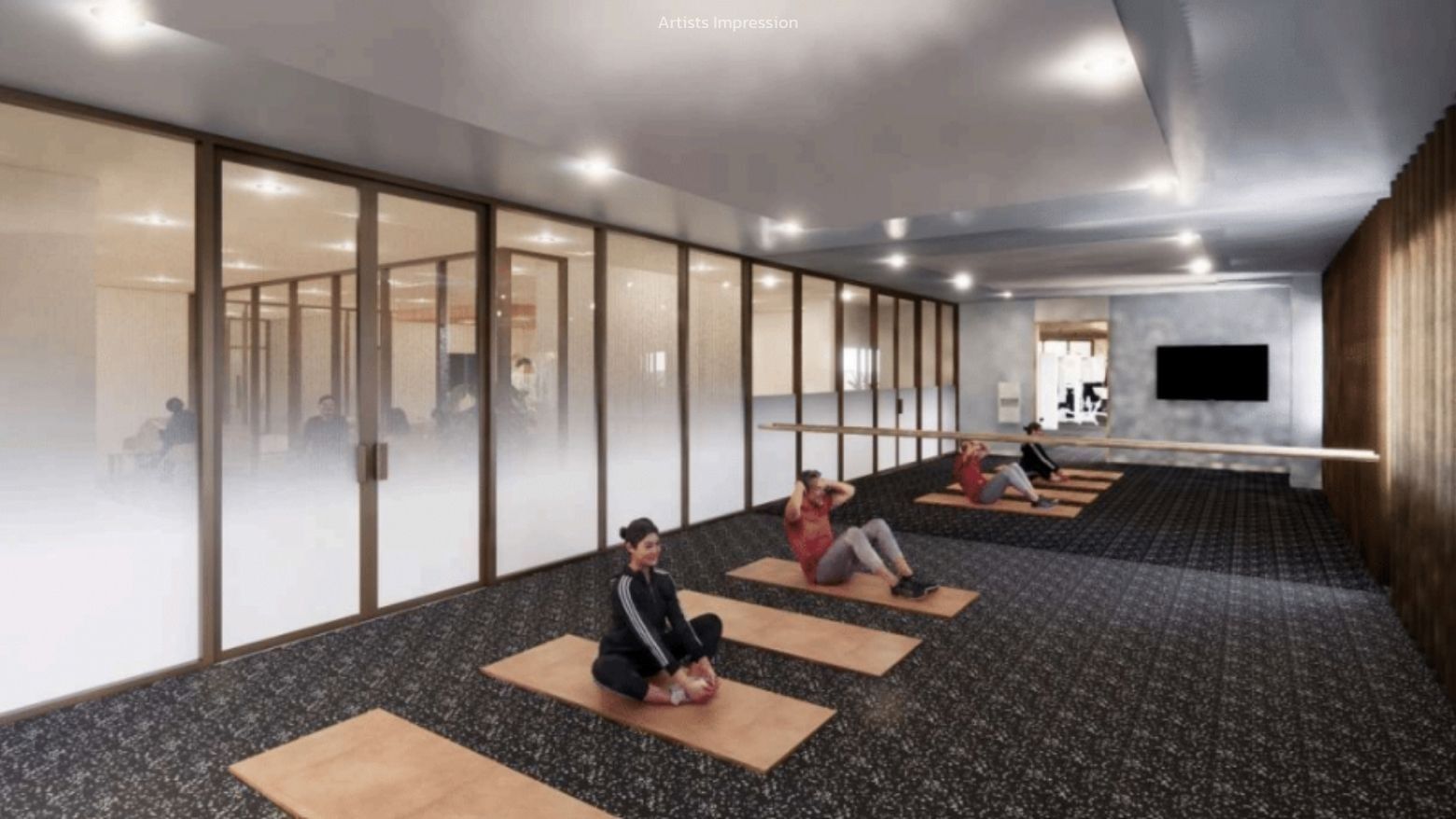 People practicing yoga in a modern gym at UniLodge Brisbane City.