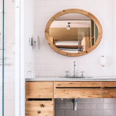 Bathroom vanity & shower in Deluxe Room at Falkensteiner Hotels