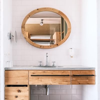 Bathroom vanity & shower in Deluxe Room at Falkensteiner Hotels