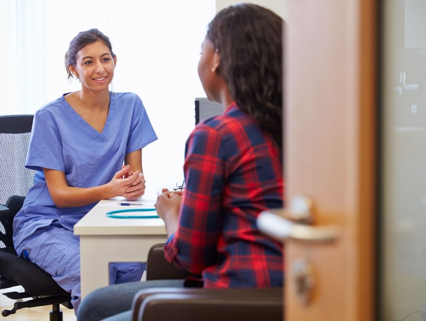 A doctor talking with a patient