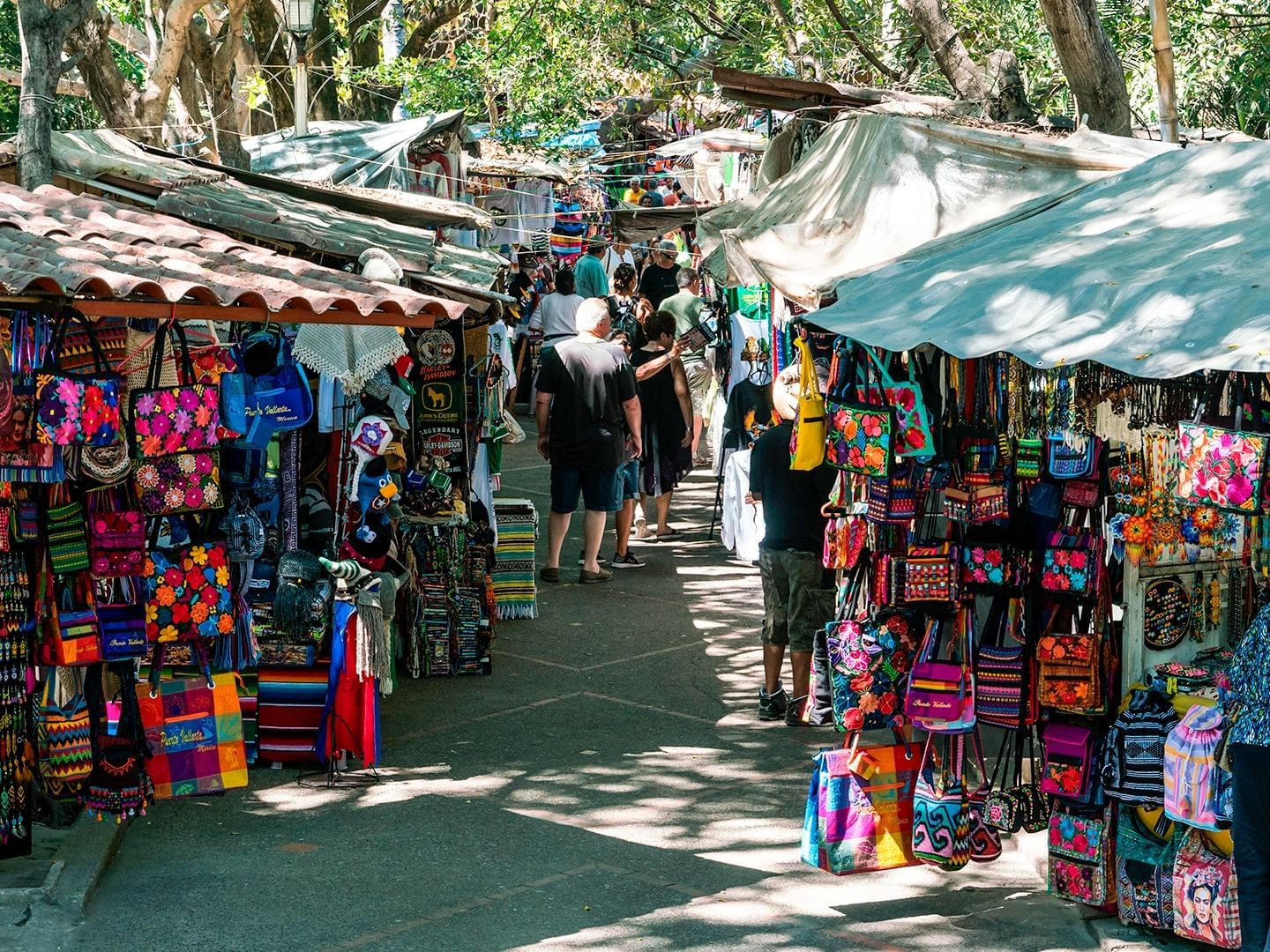People shopping in the Flea Market near Plaza Pelicanos Club Beach Resort
