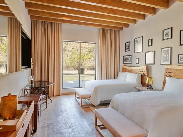 2 Double beds in Patio View Deluxe room at Live Aqua
