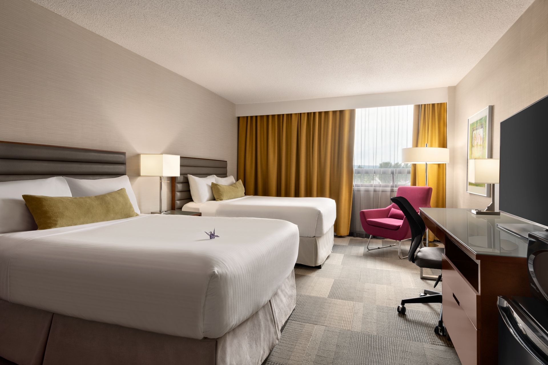 Two beds in modern hotel room