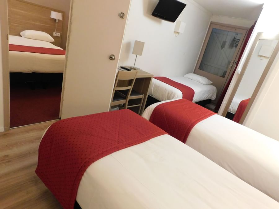 Triple beds in Hotel Ambacia at The Originals Hotel