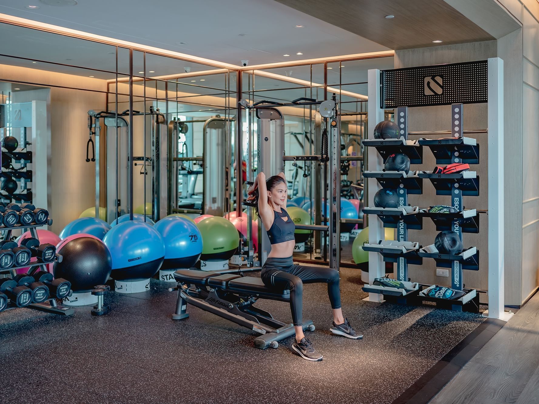 A lady in Fitness Studio at Carlton Hotel Bangkok Sukhumvit