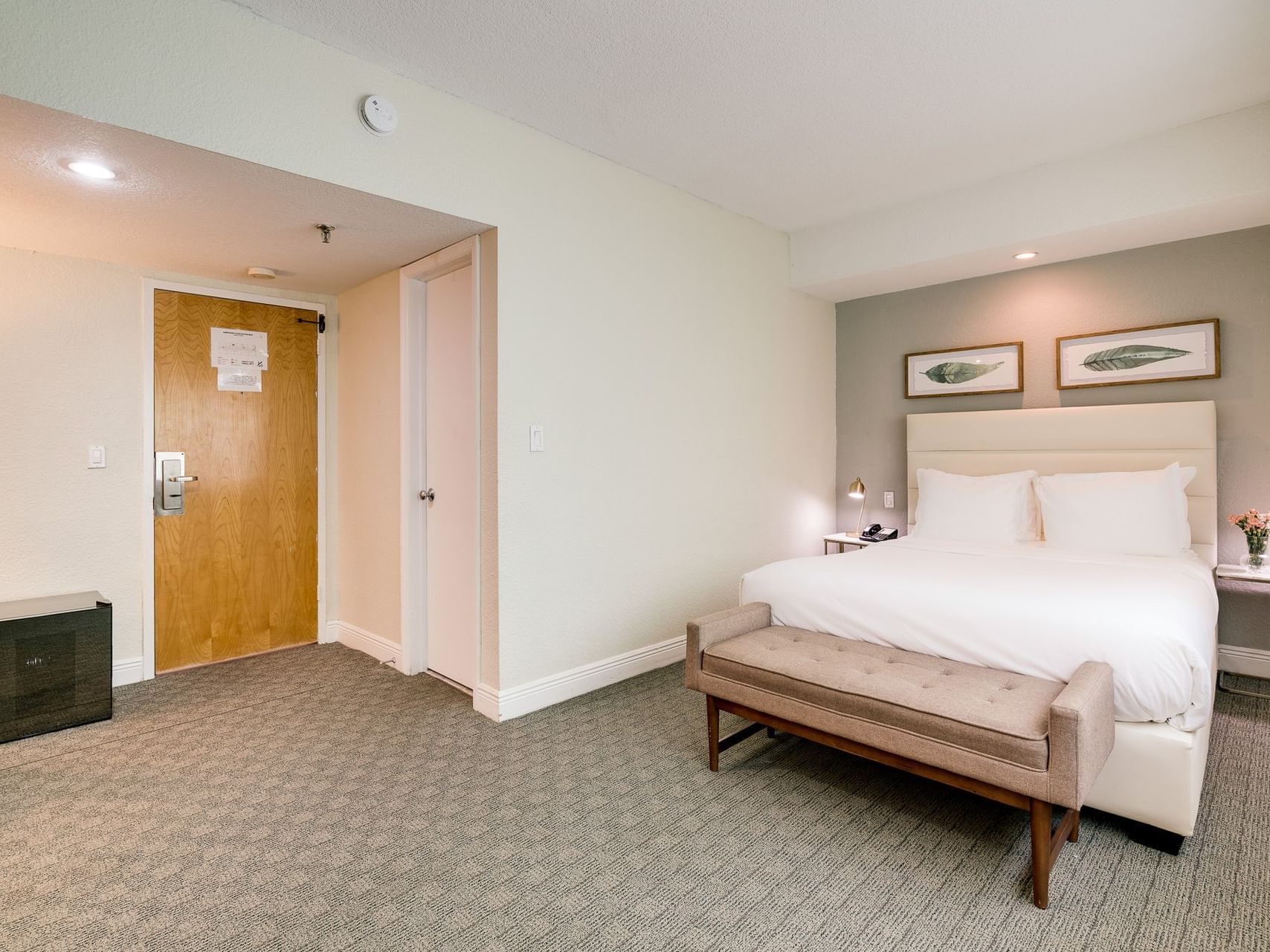 Interior of Standard Queen room at Crest Hotel Suites