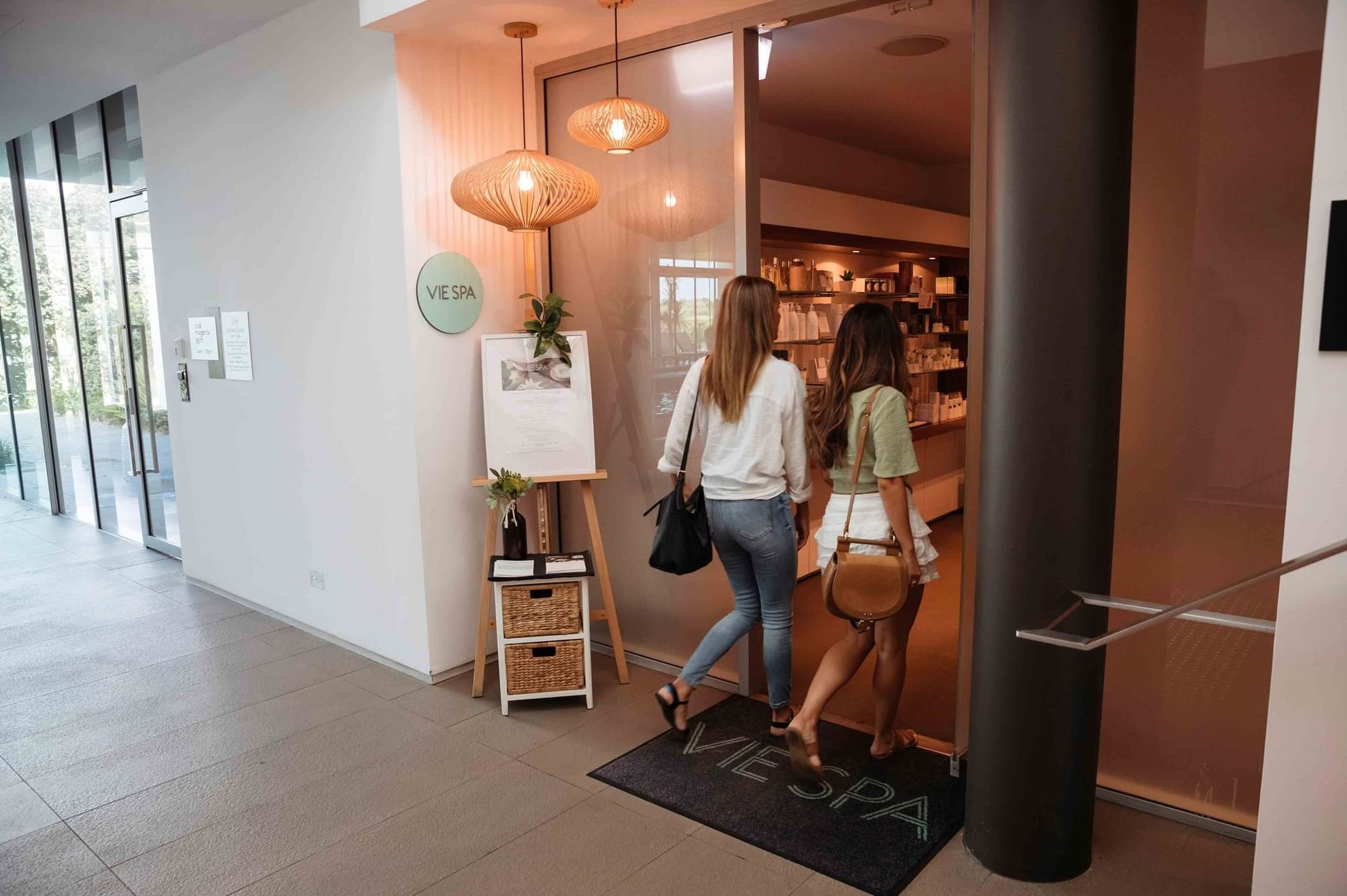 Two Women Entering to the Pullman Magenta Shores