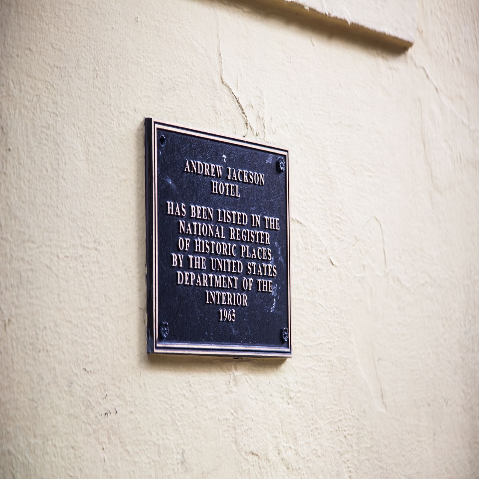 Plaque at the entrance of Andrew Jackson Hotel