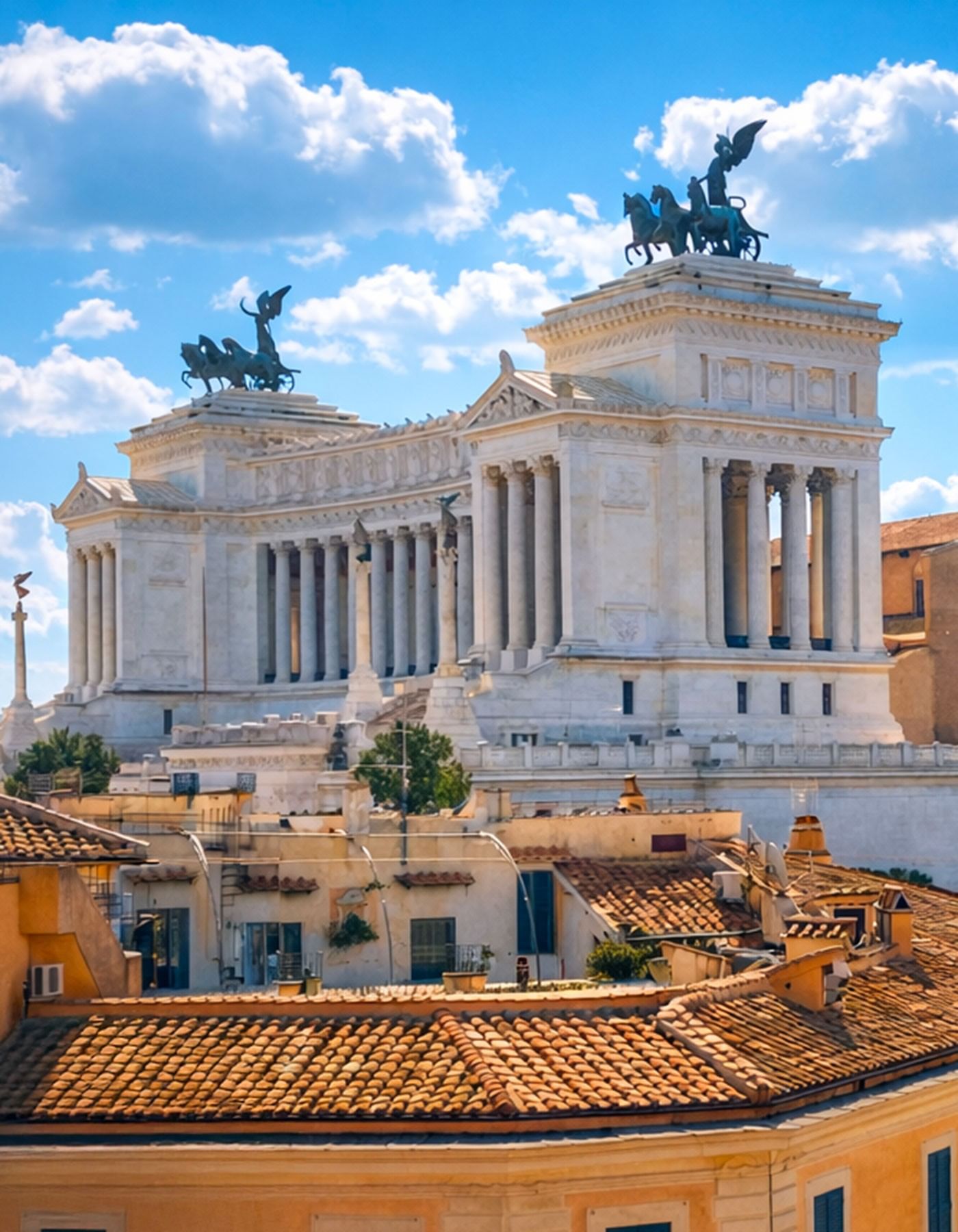 Close-up classic of Victor Emmanuel II Monument under a bright blue sky at Thompson Rome