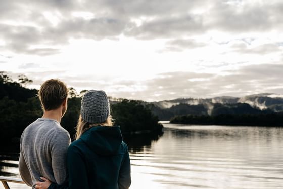 A couple looking at the lake near Gordon River Cruise