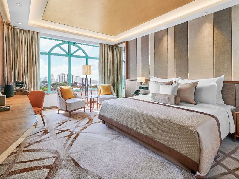 Living room with a work space and cozy loungers in Suite at Sunway Hotel Seberang Jaya