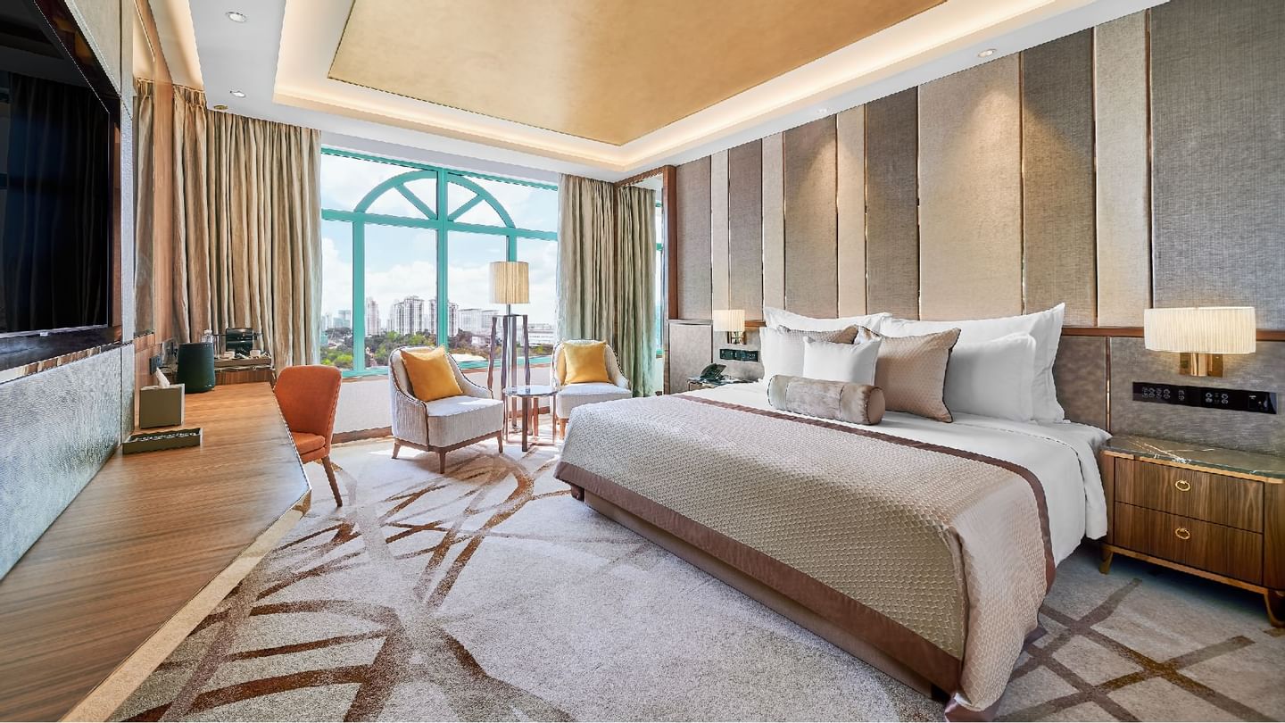 Living room with a work space and cozy loungers in Suite at Sunway Hotel Seberang Jaya