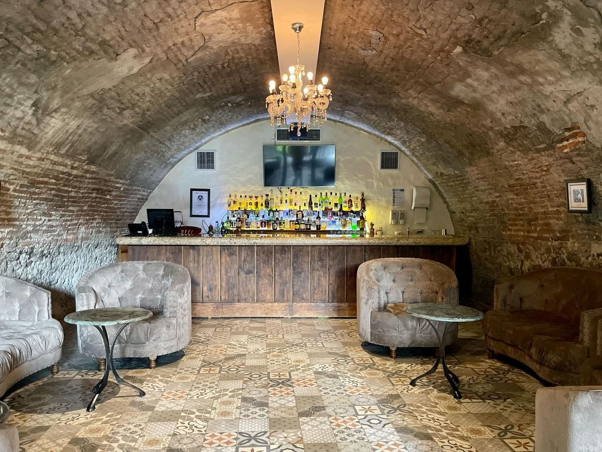 Interior & decor of a bar with brick walls in Stelaris Bar at Fiesta Americana