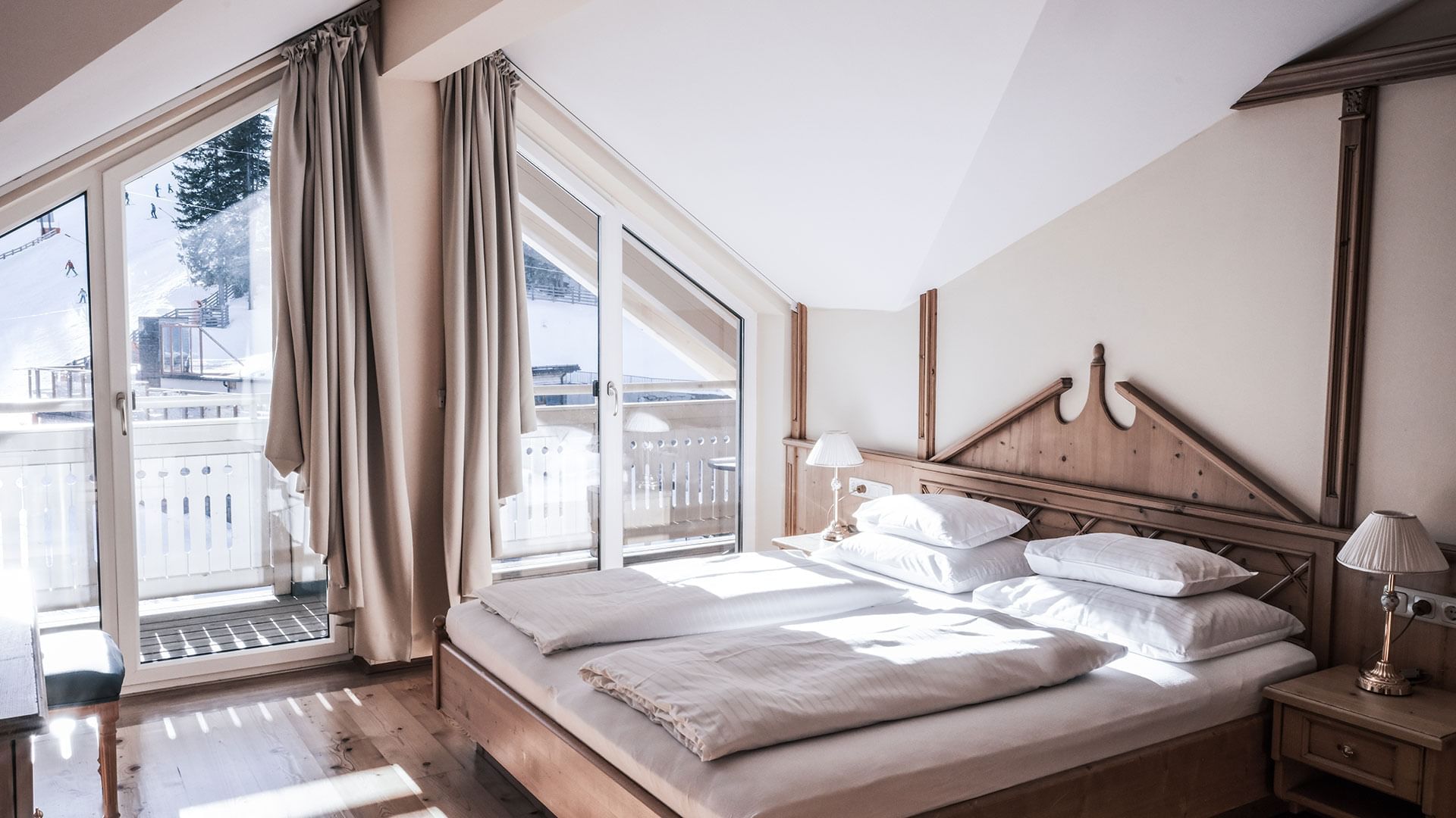 Large bed in Family Maisonette at Falkensteiner Hotels