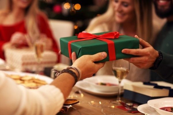 Loved ones giving each other holiday gifts