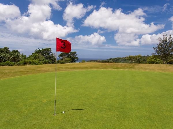 Red flag number three on golf course at Warwick Le Lagon 