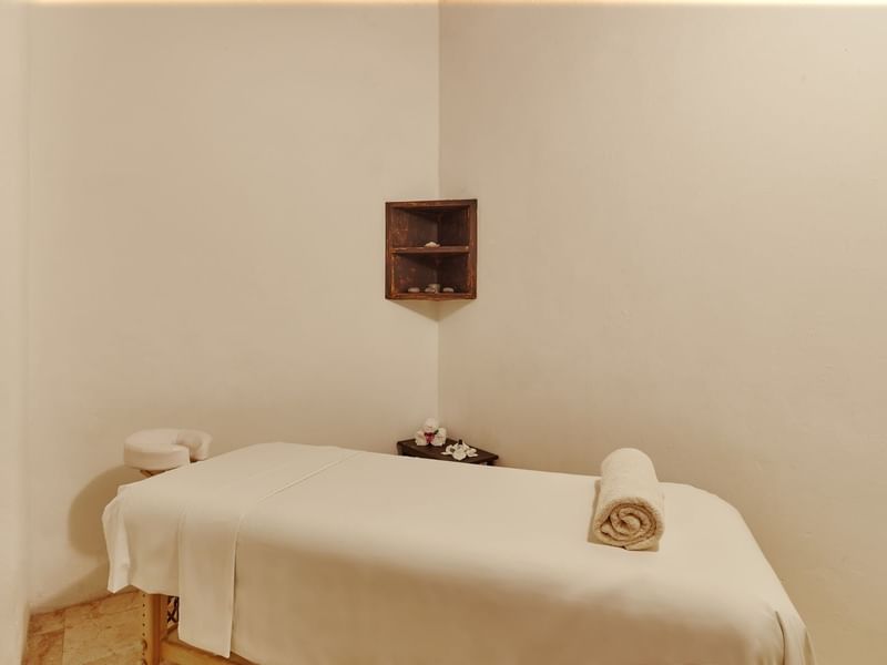 Massage bed arranged in Ki'OL Spa treatment room at The Explorean Kohunlich