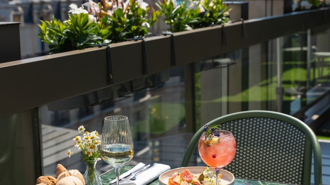 Terrace dining with Eiffel Tower view at La Terrasse Le W, Warwick Champs-Elysées, Paris.